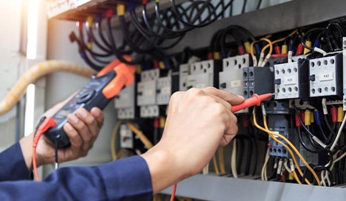 Electrician testing circuit panel