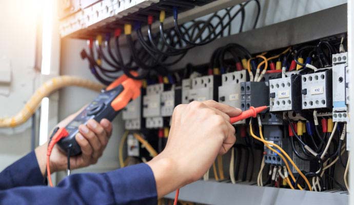 Expert inspecting electrical connections