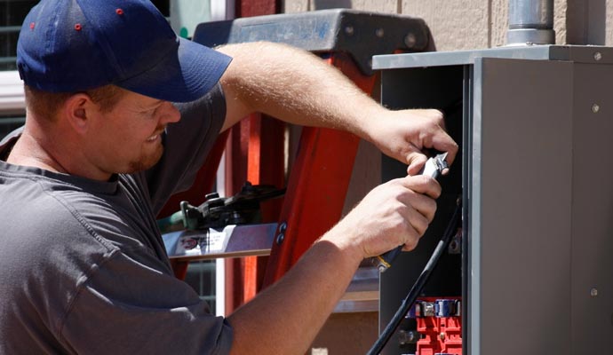 Technician repairing generator