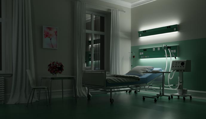 A dimly lit hospital room at night