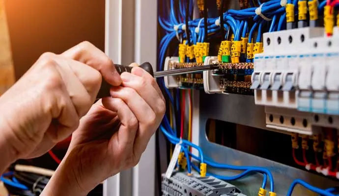 A professional repairing electrical panel