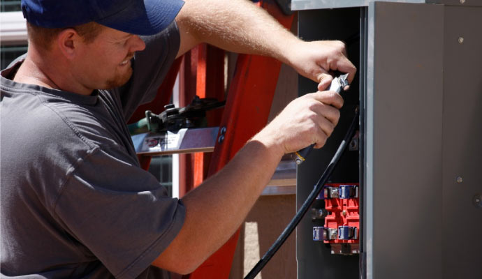 Technician repairing generator