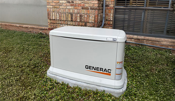 White Generac generator installed outside of a home